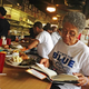 Martha Williams of Norfolk, Va., leafs through Soul Food: The Surprising Story of an American Cuisine, One Plate at a Time, by Adrian Miller, while having lunch at Florida Avenue Grill May 4, 2014, in Washington, D.C. Williams was in town visiting grandson Andrew Boyd Jr., who attends Howard University, and asked him where to go for some good soul food.
Nicole L. Cvetnic/The Root